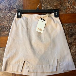 New with tags tan GB skirt. Size S never worn